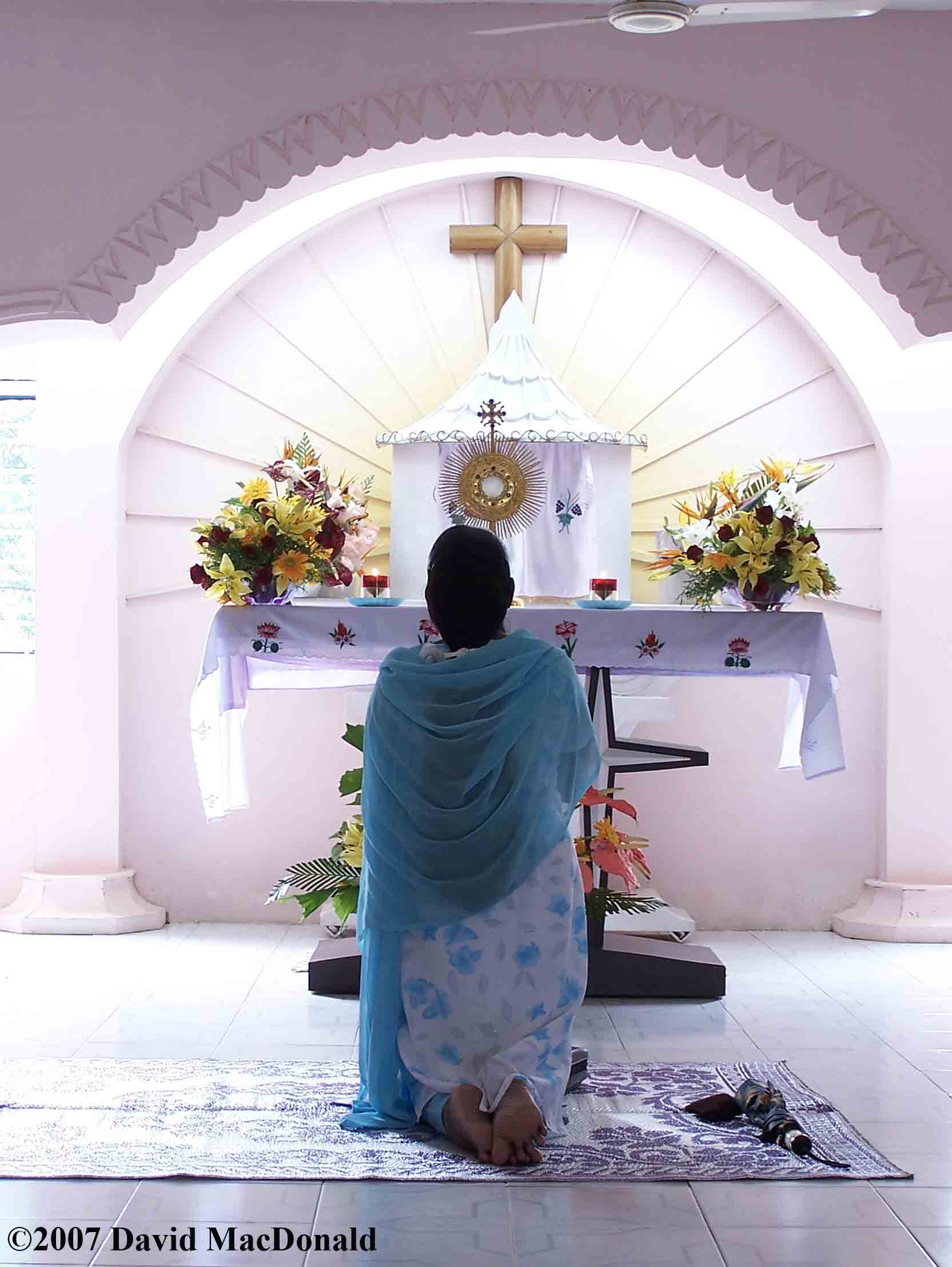 Woman praying india